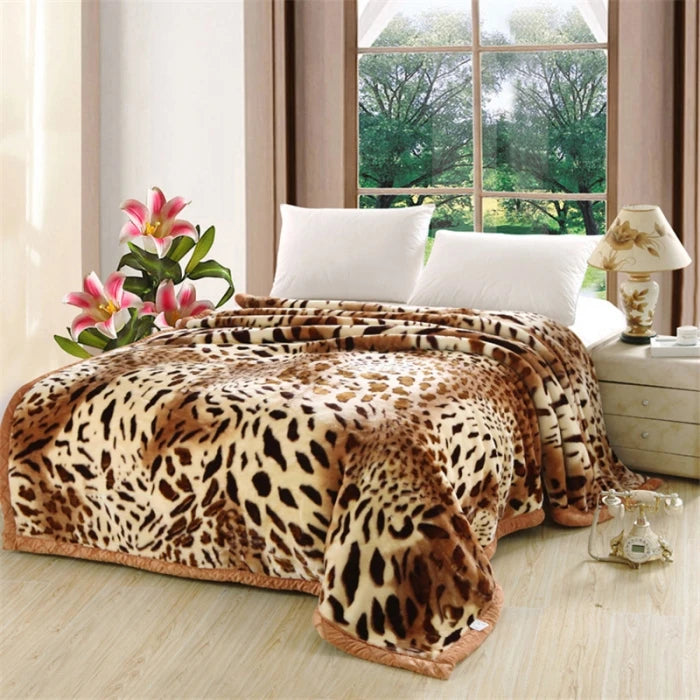A plush mink fleece king size blanket with rose and peony floral pattern is displayed on a bed.