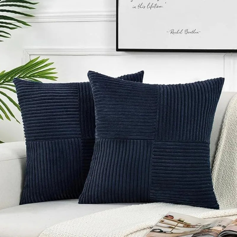 Navy blue retro corduroy patchwork pillow covers displayed on a white sofa.