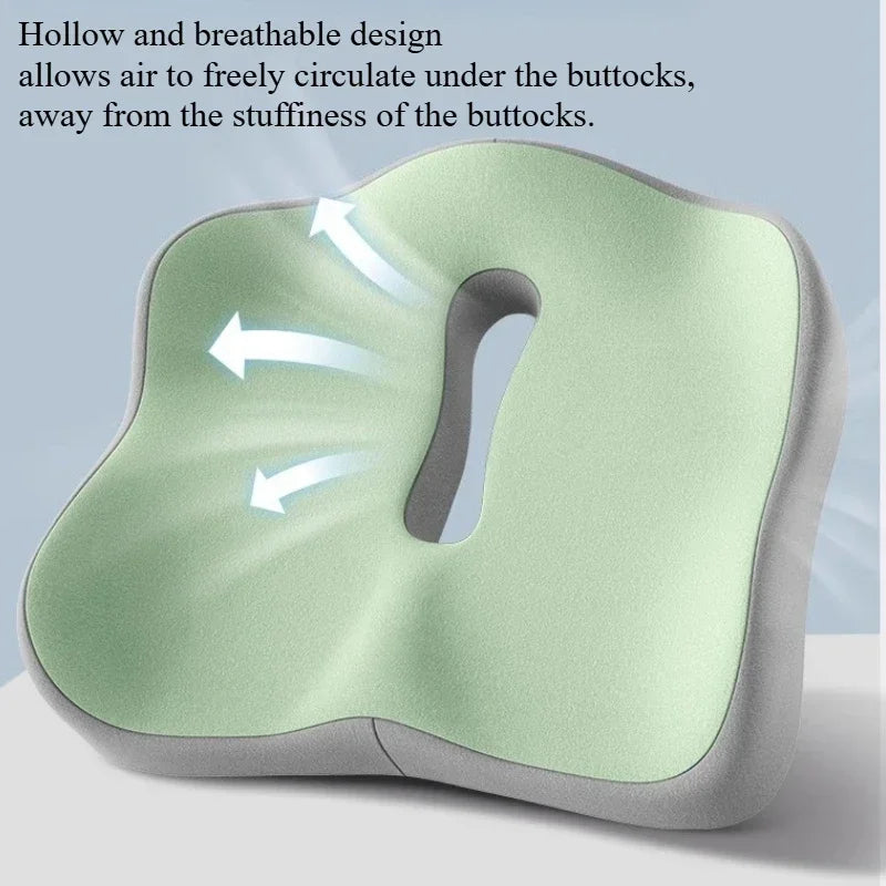 A light green ergonomic memory foam seat cushion is shown with arrows indicating air circulation under the buttocks.