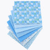 A stack of light blue cotton fabric squares featuring various floral and dot patterns for crafting.