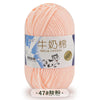 A ball of pink milk cotton yarn labeled in Chinese and English for knitting