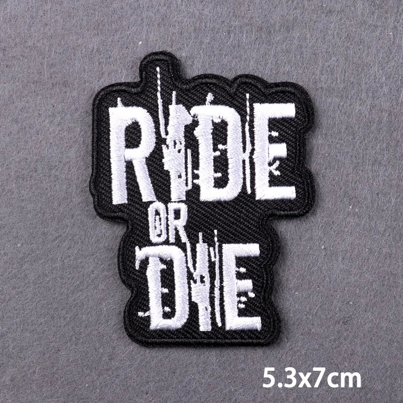 Black embroidered patch with white text READ OR DIE on a dark gray background