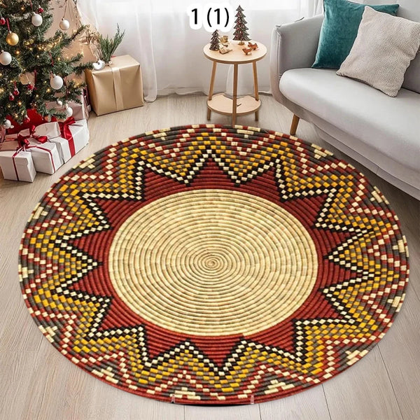A round woven rug with geometric patterns in yellow, red, and natural tones on a light wooden floor.