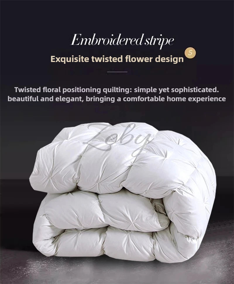 A white, fluffy quilt or duvet is shown, featuring an embroidered stripe and twisted flower design.