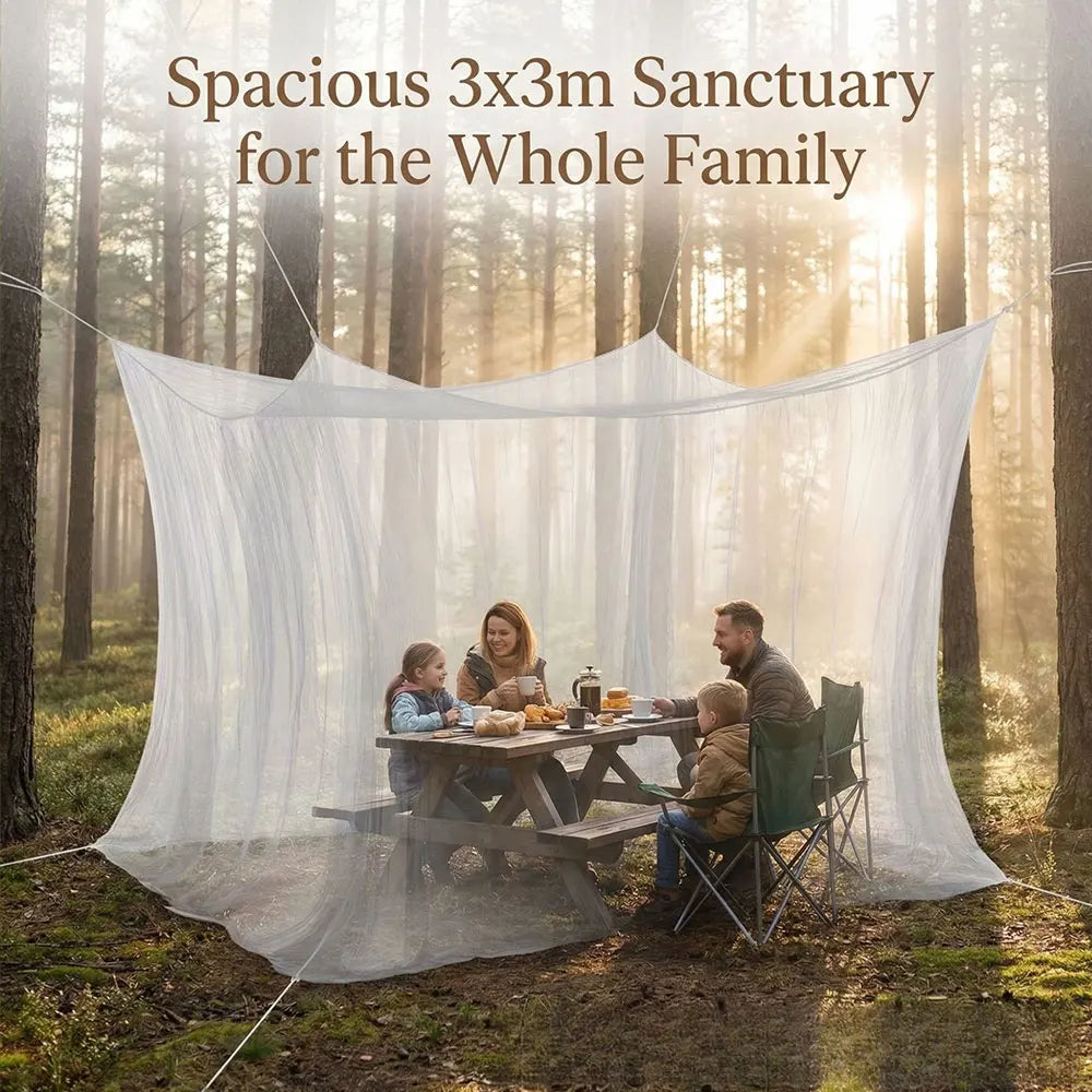 A family is eating outdoors under a spacious 3x3m sanctuary mosquito net in a forest setting.
