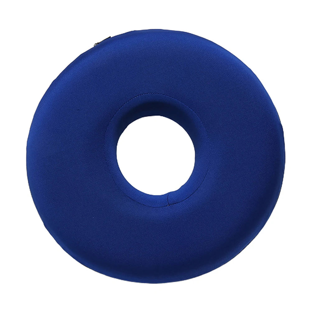 A deep blue, circular ear piercing pillow designed for comfort during sleep.