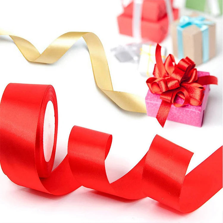 Red satin ribbon roll for crafts and gift wrapping shown in various rolls and a finished gift box.