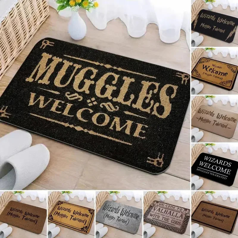 A set of black entrance mats with gold lettering welcoming wizards and muggles.
