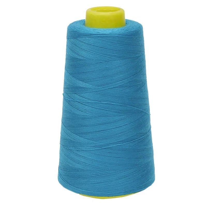 A spool of blue sewing thread with a yellow core.
