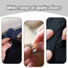 A hand is using a stainless steel sewing kit with various size needles to sew fabric.