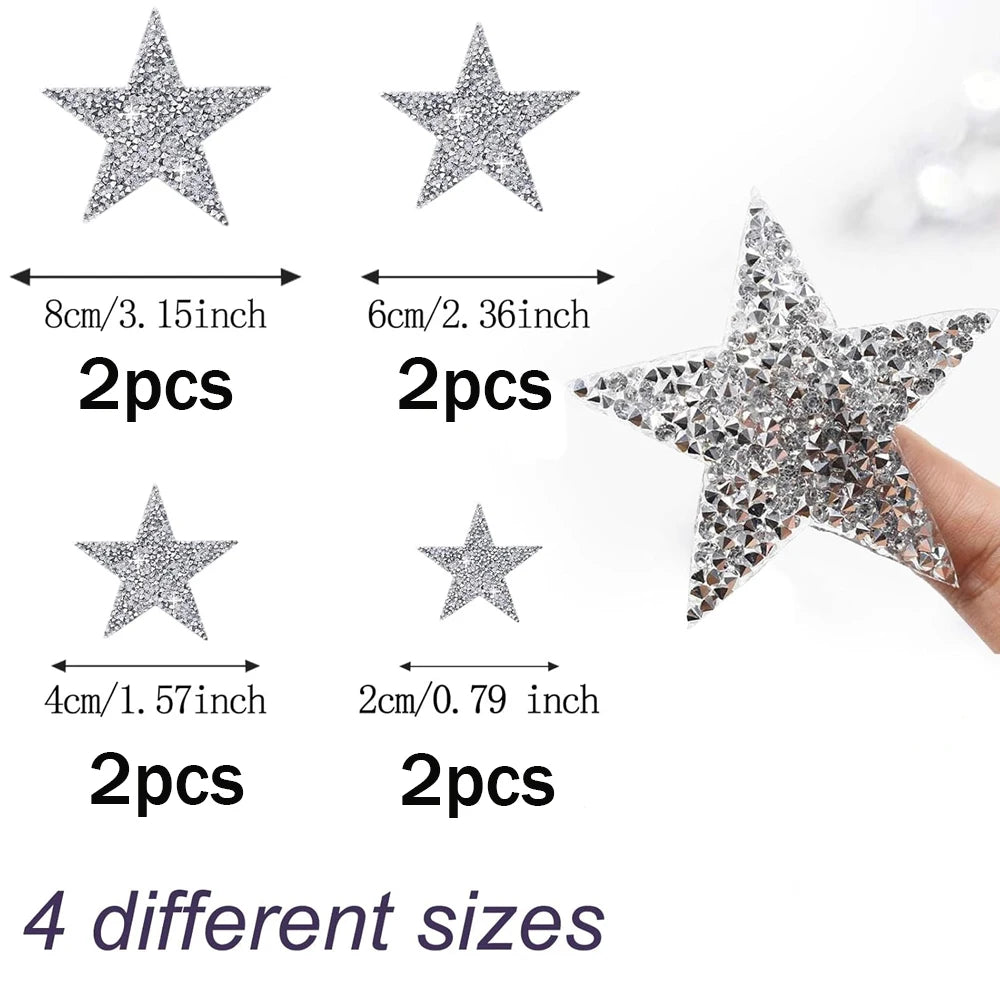 A collection of four different sized glitter star iron-on patches for clothing repair and decoration.