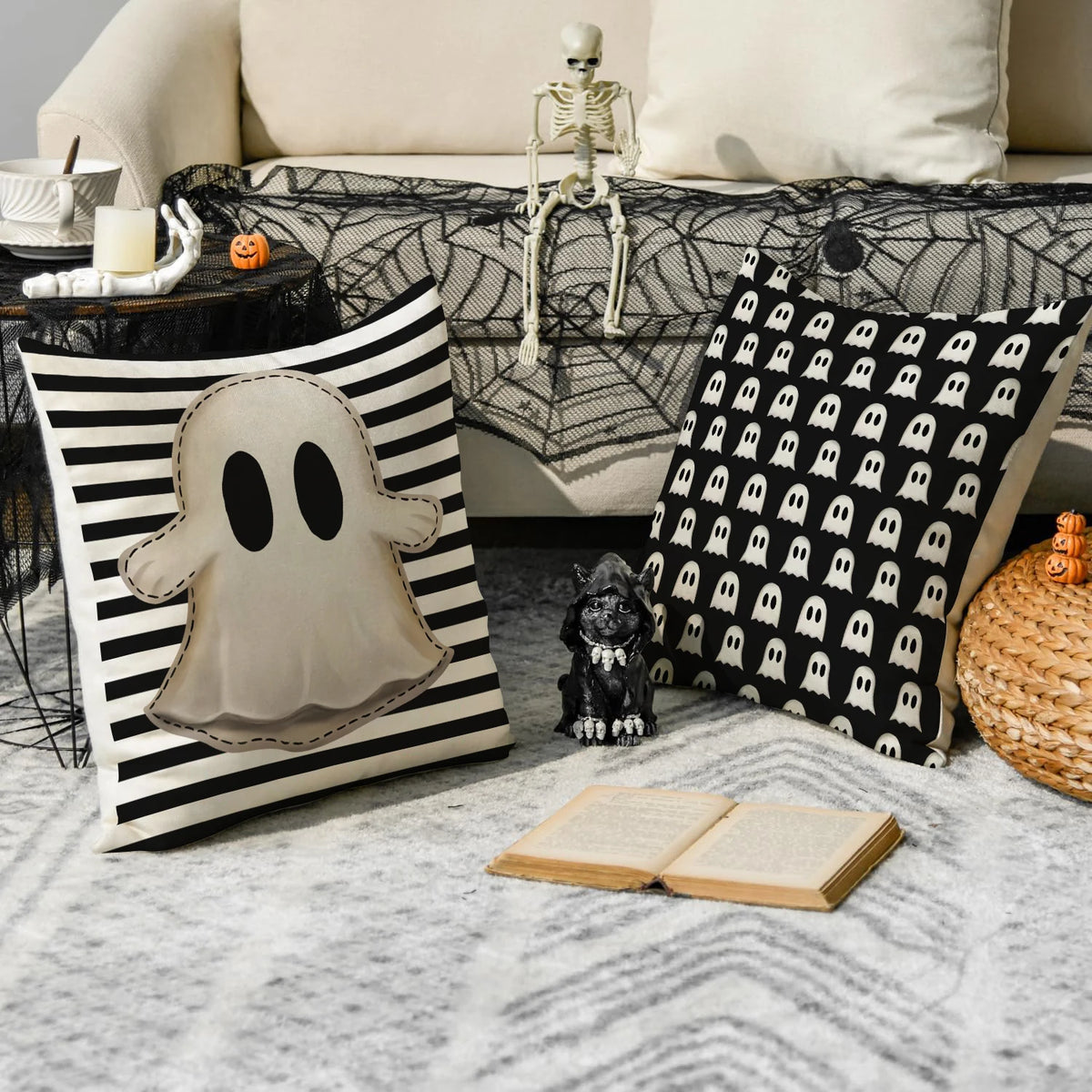 A set of four Halloween cushion covers featuring ghost, pumpkin, and skull designs displayed on a sofa.