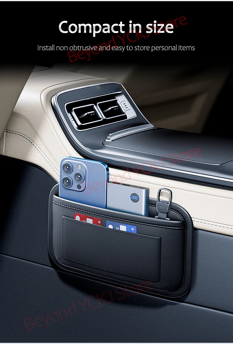 A black universal car organizer storage bag holding several smartphones in a car interior slot.