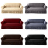 Four dustproof stretch sofa slipcovers in beige, gray, red, and black with ruffled hems.