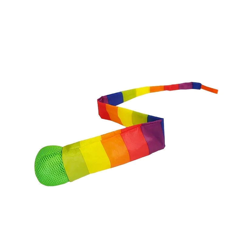 A rainbow colored comet ball with a soft tail, featuring stripes of various colors like red, orange, yellow, green, and blue.