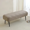 A beige elastic jacquard bench cover used as protection for a piano, dining, or entryway seat.