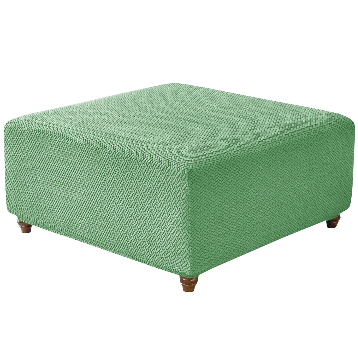 A square ottoman covered in a textured, sage green stretch jacquard fabric.