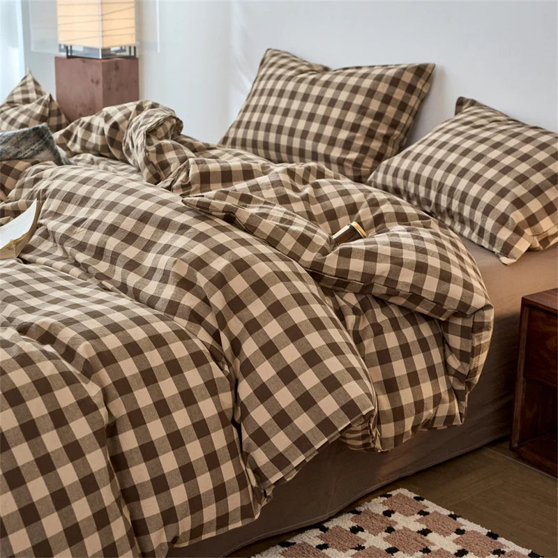A brown and beige plaid duvet cover set with a checkered pattern on a bed.