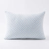A light blue quilted memory foam pillow with a diamond pattern.