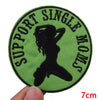 A round, olive green embroidered patch featuring a silhouette of a woman and the text SUPPORT SINGLE WOMENS