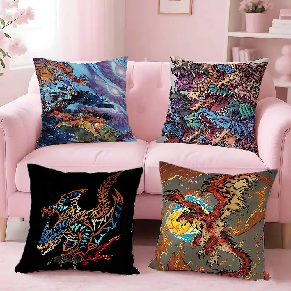 A set of four pillows featuring anime style monster prints on a pink sofa.