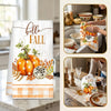 Two hello fall kitchen towels featuring pumpkins and plaid designs displayed on a countertop.