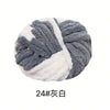 A ball of chunky acrylic yarn in gray and white stripes for knitting and crochet projects.
