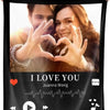 A black photo collage throw blanket featuring a picture of a man and a woman making heart signs.
