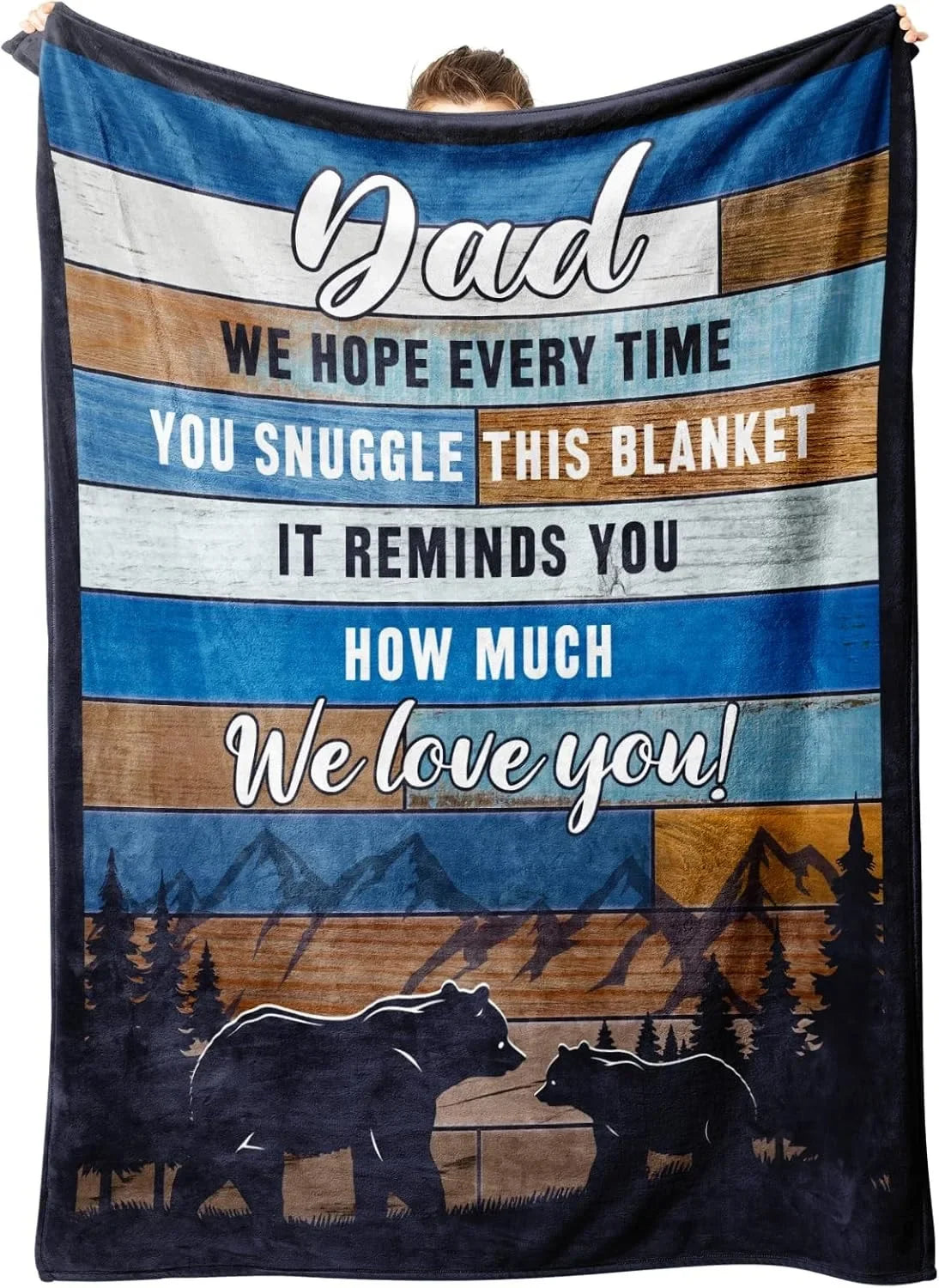 A dark blue blanket featuring text that says Dad we hope every time you snuggle this blanket it reminds you how much we love 