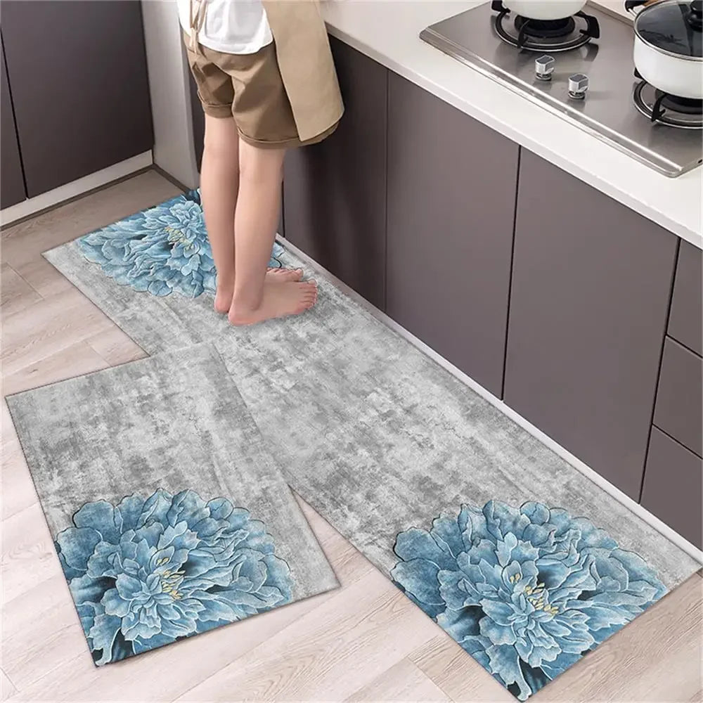 A set of two non-slip waterproof kitchen rugs with a diamond print placed on a light wood floor.