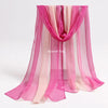 Pink and peach sheer scarves draped in a flowing fabric for sensory play