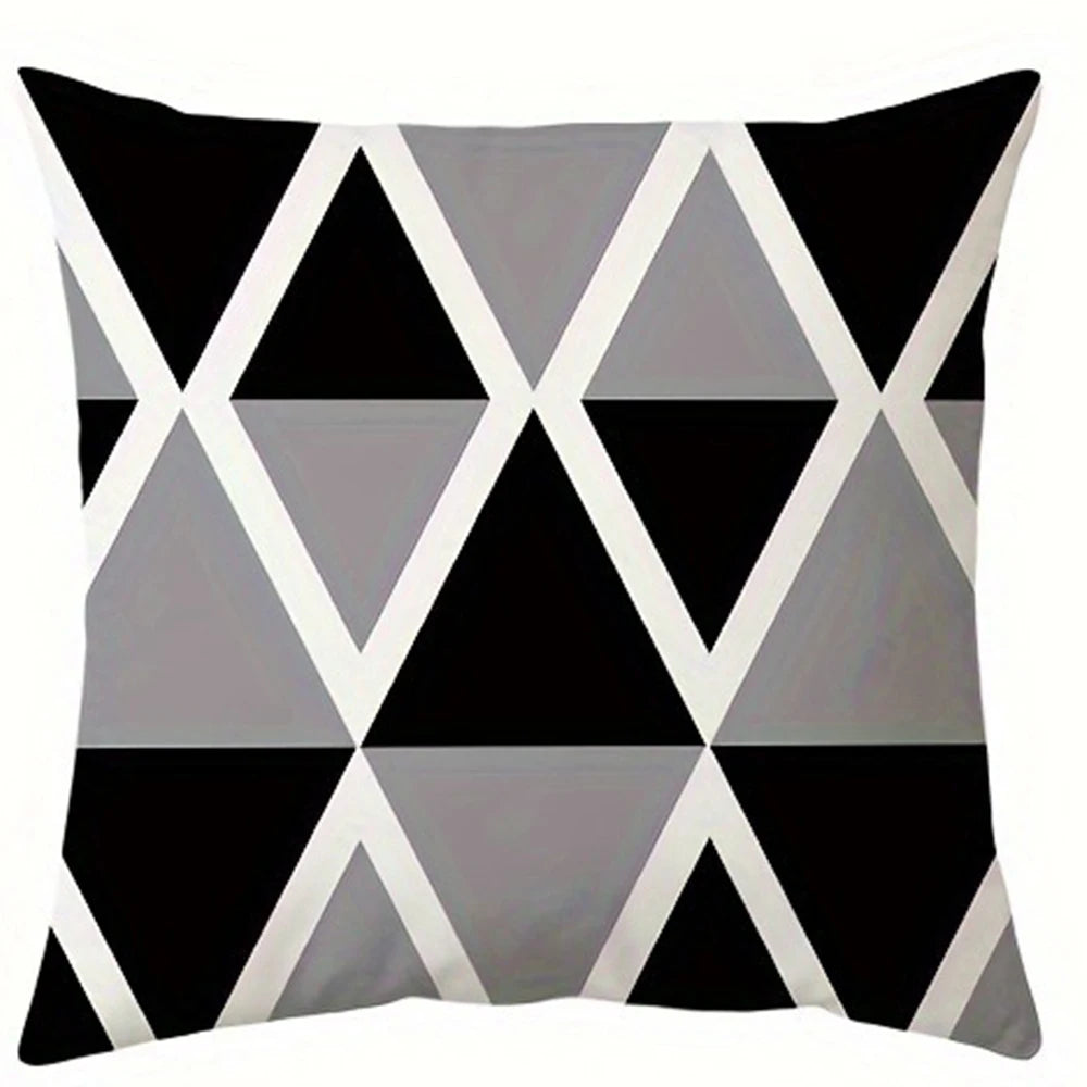 A square pillowcase cover featuring a modern geometric pattern of black and gray triangles.