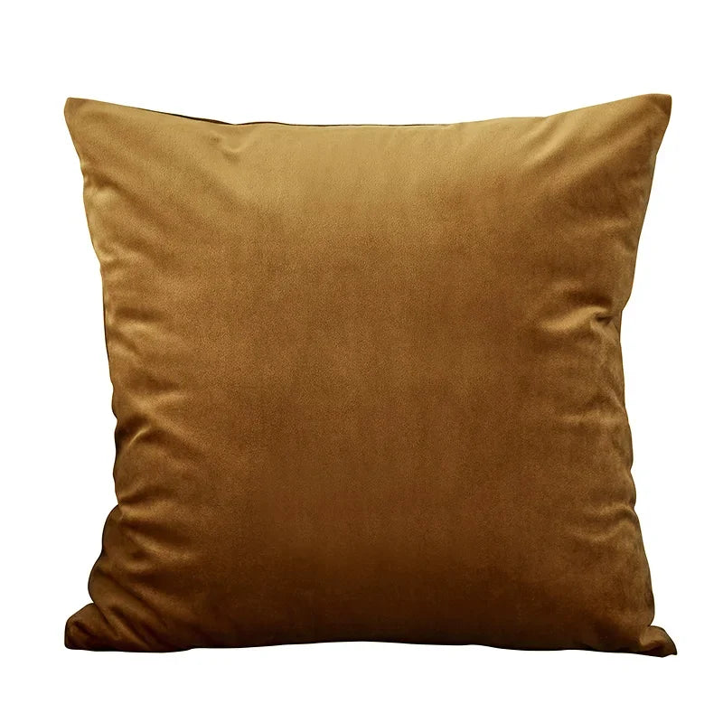 A square velvet throw pillow cover in a rich golden brown color.