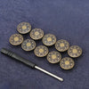A set of adjustable metal snap buttons with a gold finish arranged on a dark blue fabric.