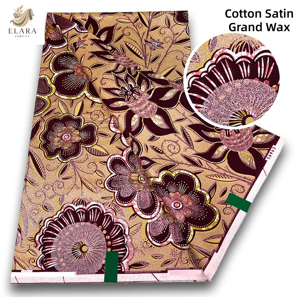 Cotton satin grand wax fabric featuring intricate floral patterns in gold and purple tones