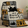 A black and yellow patterned flannel throw blanket featuring cat-themed sayings and illustrations.