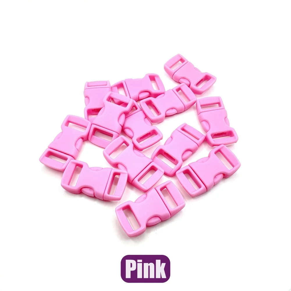 A pile of pink adjustable plastic paracord buckle bracelets.