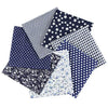 A collection of patterned cotton fabric squares featuring various prints including stripes, stars, polka dots, and floral des