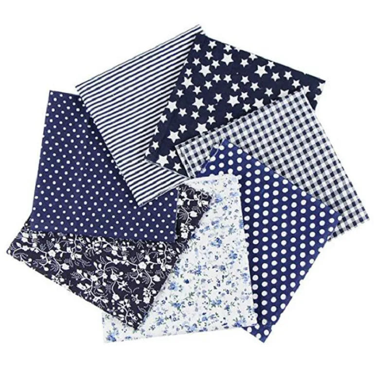A collection of patterned cotton fabric squares featuring various prints including stripes, stars, polka dots, and floral des