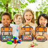 A girl holds an orange and blue cartoon birthday goodie bag with a floral crown in a bright outdoor setting.