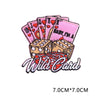 A set of pink and red heart letter patches stacked above a Wild Card text design.