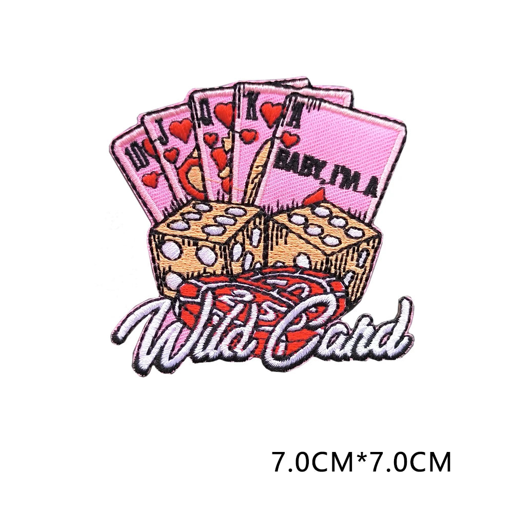 A set of pink and red heart letter patches stacked above a Wild Card text design.