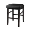 A black waterproof PU leather bar stool cover with a wooden frame.