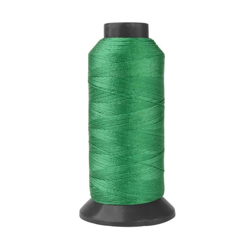 A roll of heavy duty 3-ply nylon sewing thread in a dark green color.