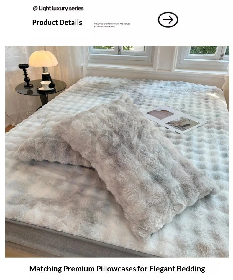 A fluffy, light gray faux rabbit fur fitted sheet set displayed on a bed with matching pillowcases.
