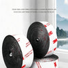 Rolls of multifunctional adhesive back velcro hook and loop tape in black and white on a white surface