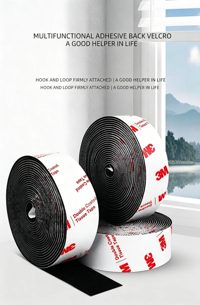 Rolls of multifunctional adhesive back velcro hook and loop tape in black and white on a white surface