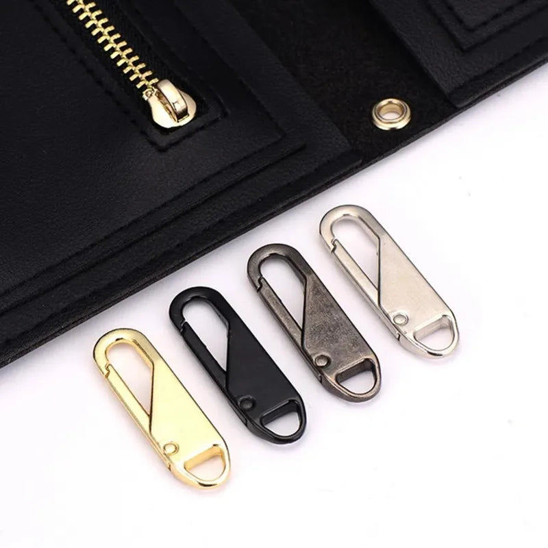 A black leather wallet shows a gold zipper puller and several detachable metal zipper pullers.