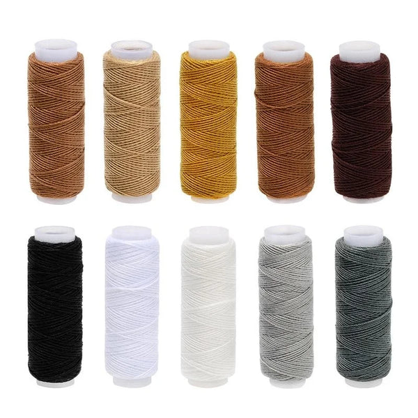 A collection of ten rolls of heavy duty denim sewing thread in various colors including brown, yellow, and dark shades.