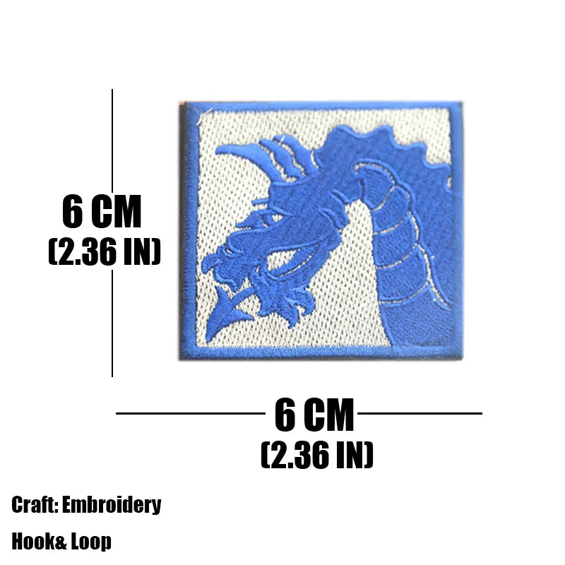 A blue embroidered tactical patch featuring a stylized dragon design on a white background.